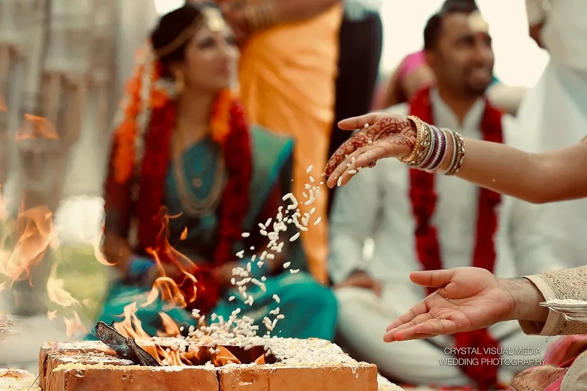 Traditional wedding ritual photographed by Crystal Visual Media, representing broader wedding coverage